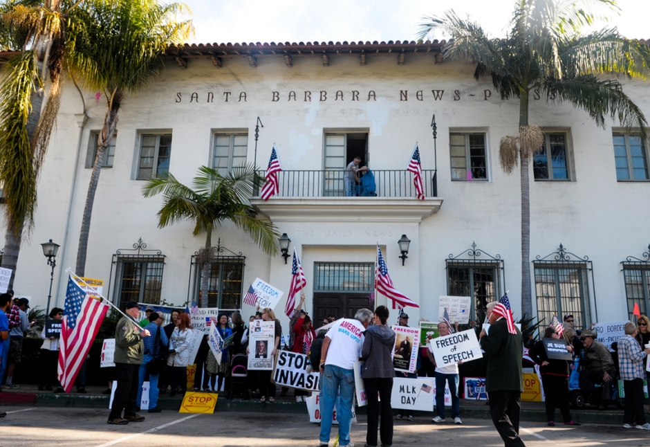 Protesters and counterprotesters rally in front of the Santa Barbara News-Press office.
